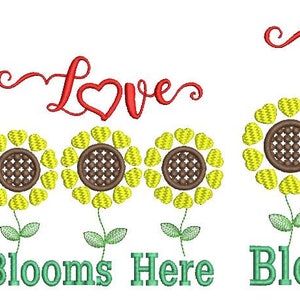 May include: Embroidered design featuring three sunflowers with yellow petals and brown centers, green stems and leaves. The word "Love" is above the flowers in red script, and "Blooms Here" is below in green.