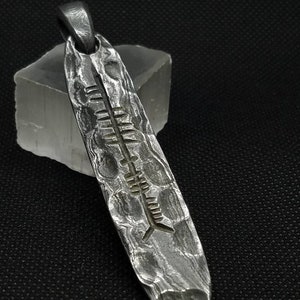 Very unique damascus steel ogham amulet/talisman pendant. Can be personalized