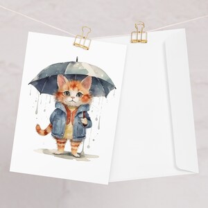 Cartão de felicitações em branco com gatinho na chuva