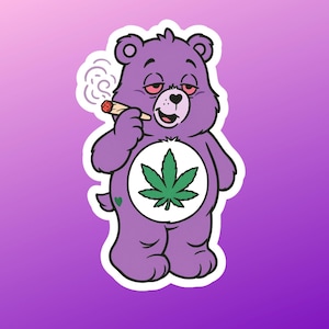 May include: A purple cartoon bear sticker with a white border. The bear is holding a lit joint and has red eyes. A green cannabis leaf is on its belly. The background is a gradient of purple.