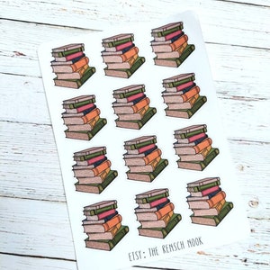May include: A sheet of stickers featuring stacks of books with colorful spines. The books have green, orange, pink, and brown covers. The text "ETSY: THE RENSCH NOOK" is printed at the bottom of the sheet.