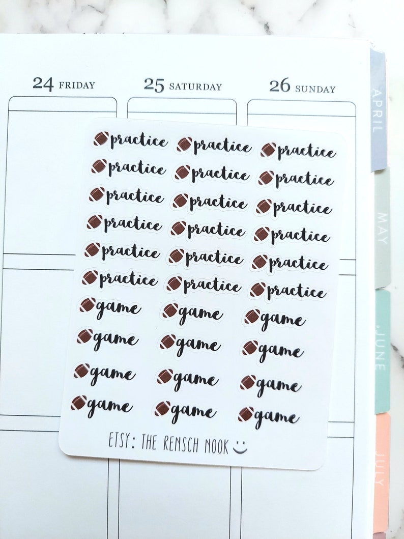 May include: A sheet of white planner stickers with brown footballs and black text. The text reads "practice" and "game". The stickers are for a planner or calendar.