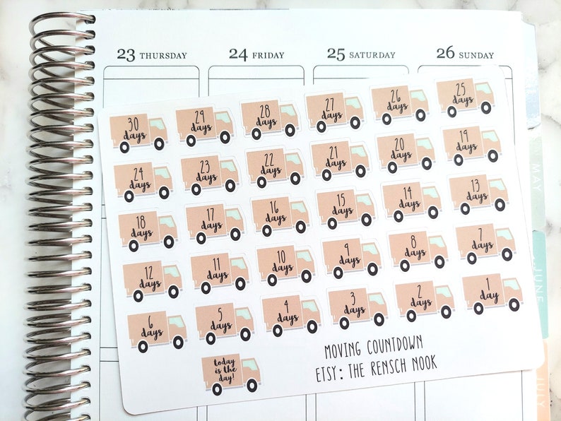May include: A sheet of 30 moving countdown stickers featuring a cartoon truck design. Each sticker has a number from 1 to 30, representing the number of days until the move. The stickers are beige with black outlines and a light green accent. The text "Moving Countdown" and "Etsy: The Rensch Nook" is printed at the bottom of the sheet.