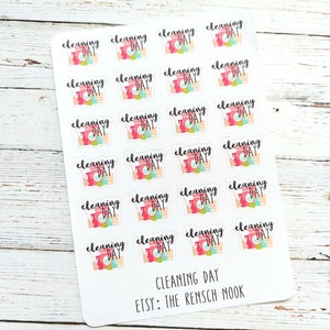 May include: A sheet of 20 stickers featuring a cartoon illustration of a washing machine, cleaning supplies, and the text "Cleaning Day". The stickers are on a white background. The text "Cleaning Day" and "Etsy: The Rensch Nook" are printed below the stickers.