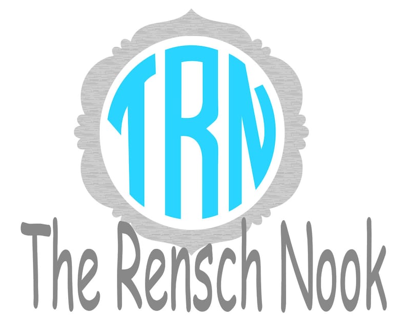 May include: A gray and white monogram with the letters "TRN" in a light blue circle. The text "The Rensch Nook" is below the monogram.