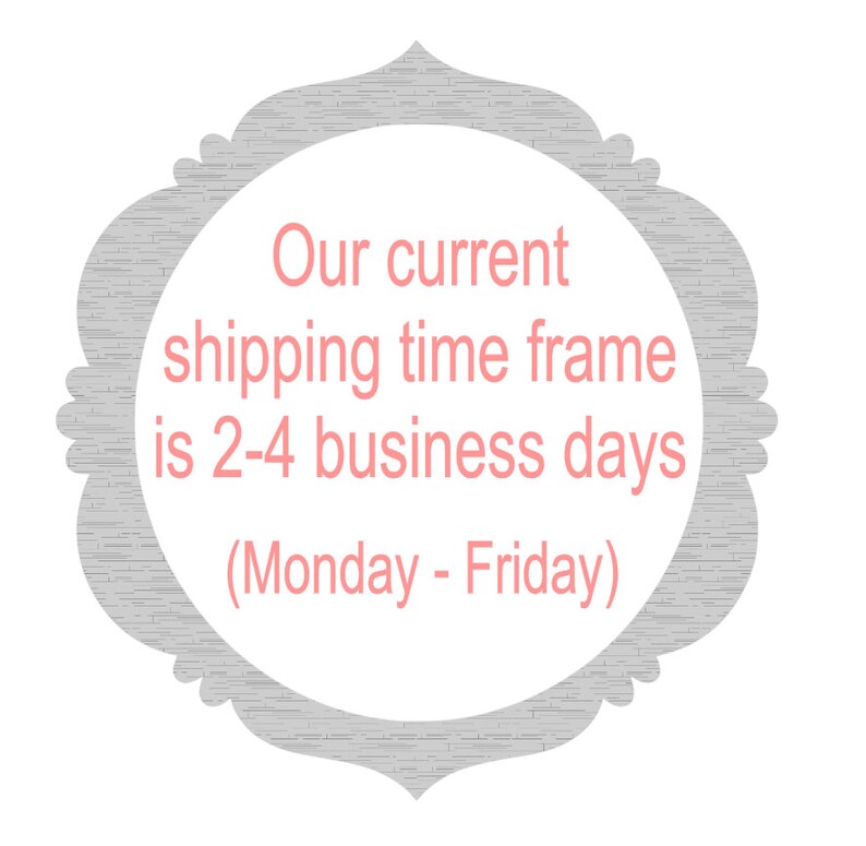 May include: A decorative, gray-bordered frame with a white interior. The text inside the frame is in pink and reads: "Our current shipping time frame is 2-4 business days (Monday - Friday)".