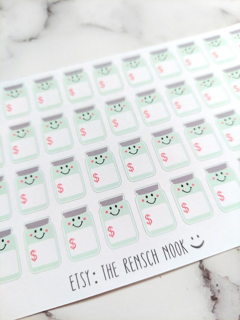 May include: Sheet of stickers featuring smiling jar illustrations with dollar signs. The jars are light green with gray lids and pink accents. The text "ETSY: THE RENSCH NOOK" is printed at the bottom.