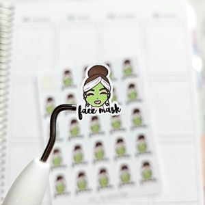 May include: A sheet of stickers with a cartoon illustration of a person wearing a green face mask and the text "face mask".