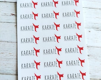 May include: A sheet of 18 red and black karate stickers with the word "KARATE" printed on each sticker. The stickers feature a red silhouette of a person performing a karate kick.