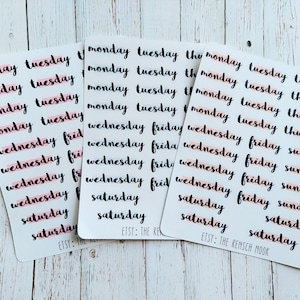 May include: A set of 4 sheets of stickers with days of the week written in black cursive. The stickers are on a white background with a pink line under each word. The text "ETSY: THE RENSCH MOOK" is printed on the bottom right corner of one of the sheets.