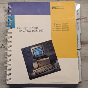 May include: A spiral-bound manual titled Setting Up Your HP Vectra 486U PC. The cover features a yellow and blue design with the Hewlett Packard logo, a list of compatible models, and an image of a vintage desktop computer with a monitor and keyboard.