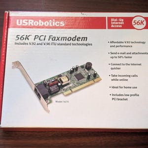 May include: A white and red USRobotics 56K PCI Faxmodem box, model 5670. The packaging displays the product, features like V.92 and V.90 technology, and mentions dial-up internet access. The box includes details about faster email, incoming call handling, and a low profile PCI bracket.