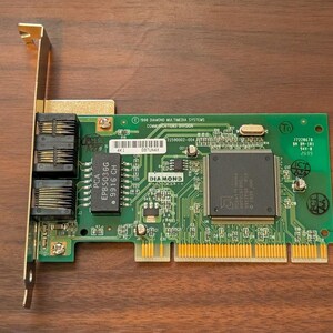 May include: A green printed circuit board expansion card featuring two black modular ports on a gold metal bracket. The board includes a large central integrated circuit chip labeled Diamond, various smaller electronic components, and gold edge connectors.