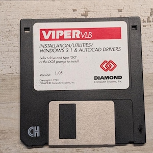 May include: A black 3.5-inch floppy disk with a white label featuring red text that reads VIPER VLB, INSTALLATION/UTILITIES/WINDOWS 3.1 & AUTOCAD DRIVERS, Select drive and type 'GO' at the DOS prompt to install, Version 1.05, and DIAMOND Computer Systems, Inc.
