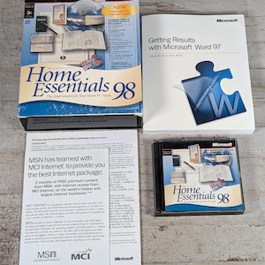 May include: A Microsoft Home Essentials 98 software box set including a Getting Results with Microsoft Word 97 manual, a CD-ROM in a plastic jewel case, and an informational flyer about MSN and MCI Internet services with white and blue text.
