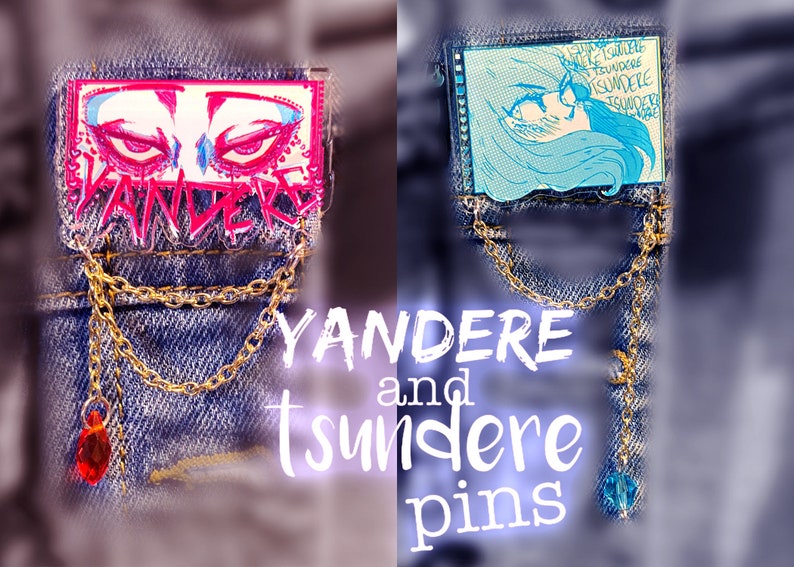 May include: Two enamel pins on a denim background. The left pin is pink and features a pair of red eyes with the word "Yandere" written in pink and white. The right pin is blue and features a cartoon girl with the word "Tsundere" written in blue and white.