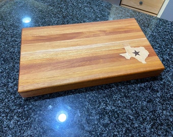 Mahogany edge grain cutting board with a Black Walnut and maple Texas inlay, state of Texas butcher block