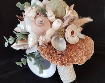 Decorative natural shell bouquet with a piece of coral-like nature...