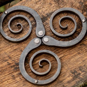 Hand forged metal trivet - unique hot pot holder with Celtic triskelion symbol - table protector and kitchen decor
