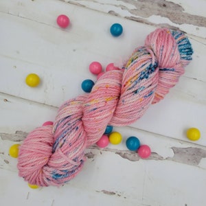 Hand Dyed Yarn in Bubblegum Colorway: Cotton Candy Pink with Blue, Yellow, and Pink Speckles