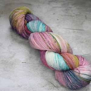 Hand Dyed Yarn in Impressionist Colorway: Purple, Teal, and Green Variegated Superwash Wool Yarn in Sock, Sport, DK, Worsted, and Bulky Yarn