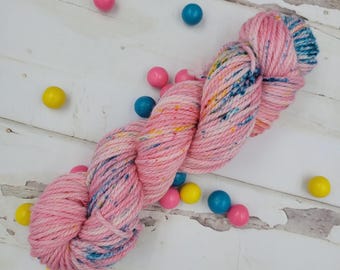 Hand Dyed Yarn in Bubblegum Colorway: Cotton Candy Pink with Blue, Yellow, and Pink Speckles