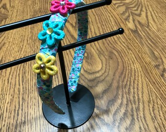 Polka dot ribbon wrapped headband with flowers