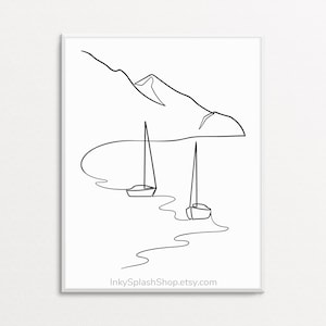 May include: Monochrome art print showing a coastal landscape. The image features two sailboats on the water, with a mountain range in the background. The print includes the text "InkySplashShop.etsy.com" at the bottom.