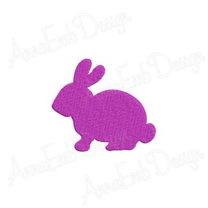 Puede incluir: Una silueta de conejo morada, un s&iacute;mbolo com&uacute;n de Pascua.