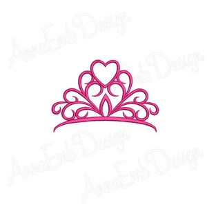 May include: A pink princess crown with a heart-shaped center. The crown has a delicate, ornate design.