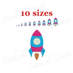 May include: A set of 10 embroidery designs of a pink and blue rocket with a white circle in the middle. The rocket has a brown flame coming out of the bottom. The designs are in different sizes.