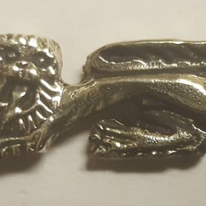 Heraldic lion solid brass badge