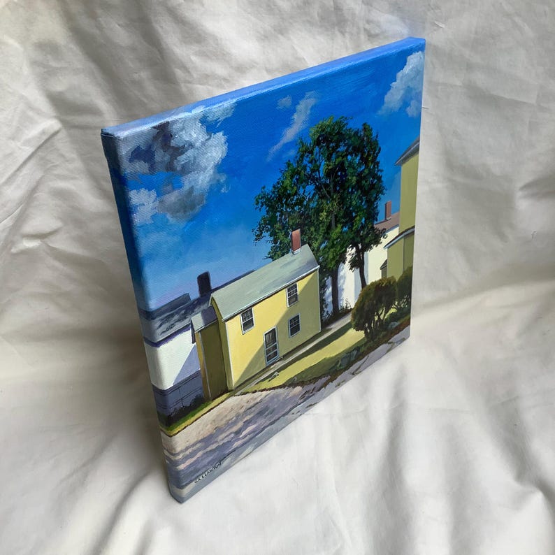May include: A painting of a yellow house with a green tree in front of it. The house has a blue roof and white trim. The sky is blue with white clouds.
