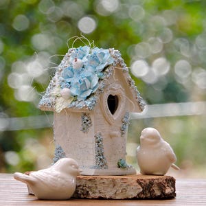 Decorative light blue birdhouse