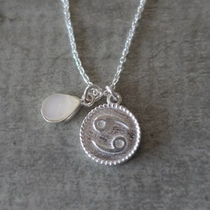 Silver necklace with a Cancer zodiac symbol medal and a rough, natural moon stone - Me and My Mood jewelry