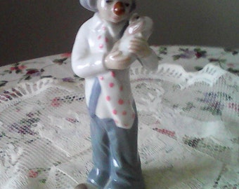 Clown with dog figurine