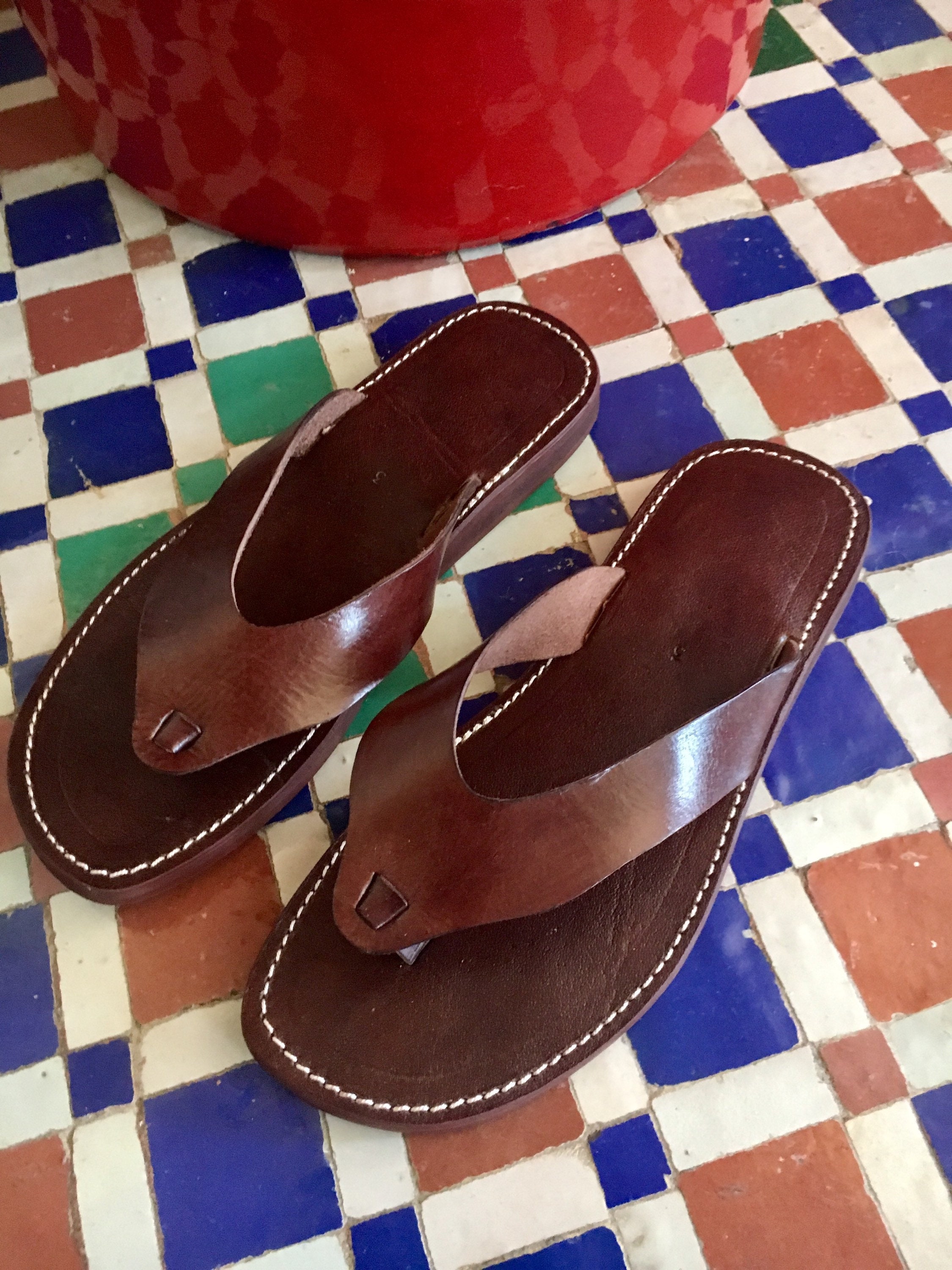 dark brown leather flip flops