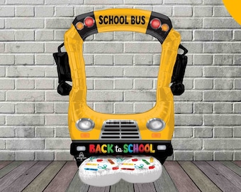 May include: A yellow school bus shaped photo booth cutout with the words "SCHOOL BUS" and "BACK TO SCHOOL" printed on it. The cutout is 1.37 metres tall.