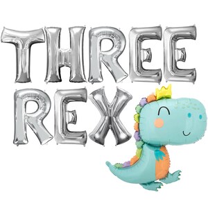 May include: Silver foil balloons spelling "THREE REX" with a blue dinosaur balloon with a crown on its head.