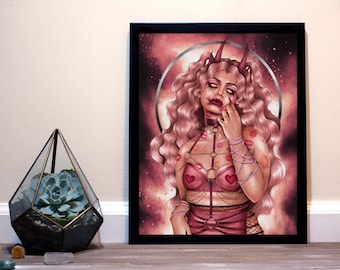 May include: A framed art print featuring a woman with pink hair, horns, and a dark aesthetic. The artwork includes a pink and red color scheme, with kiss marks and heart details on the lingerie. A succulent terrarium is in the foreground.