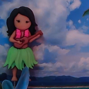 May include: A cartoon hula girl with black hair, wearing a pink lei and a green grass skirt, plays a ukulele.