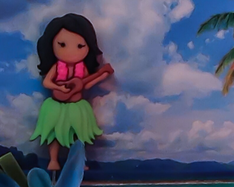 May include: A cartoon hula girl with black hair, wearing a pink lei and a green grass skirt, plays a ukulele.