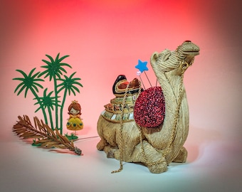 Pincushion. Camel Rinconada, Vintage, Golden Chain, Red Sparkle Fabric, Signed by Artist  4" W by 4" H,  8 oz. net, #5439 Pin Cushion