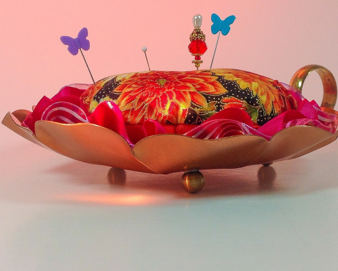 Pincushion. Copper Candleholder, Taunton, Mass. Guild Sunflowers and