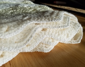 Pale yellow and cream knitted baby blanket