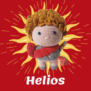 May include: A crocheted plush toy of Helios, the Greek god of the sun, with curly brown hair, a pink face, blue eyes, and a red and gray scarf. The toy is set against a red background with a yellow sunburst design.