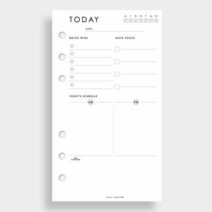 May include: A white planner page with the word "TODAY" at the top. It features sections for "Quick Wins," "Main Focus," and a schedule divided into AM and PM. The bottom of the page has the text "ELLA ICONIC".