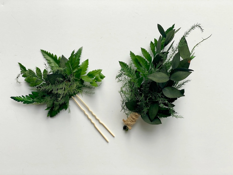 May include: Two green floral arrangements, one with a wooden hairpin and the other tied with twine.