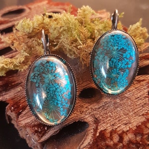 Earrings with real blue dill flowers