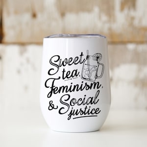 May include: White stainless steel tumbler with a black graphic that says "Sweet tea, Feminism, & Social Justice". The graphic also includes a drawing of a mason jar with a straw and a lemon slice.